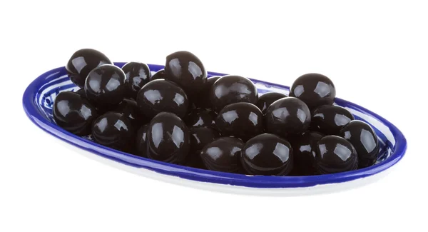 Olives black watered with olive oil in a bowl isolated on a whit — Stock Photo, Image