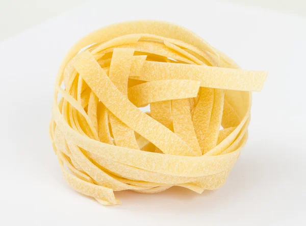 Italian pasta fettuccine nest isolated on white background — Stock Photo, Image