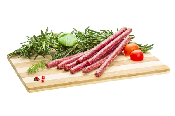 Salami with rosemary, basil and tomato — Stock Photo, Image