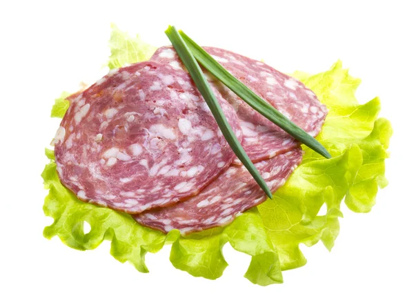 Італійської ковбаси з листям салату — стокове фото