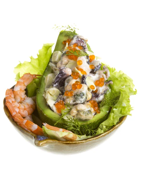 Seafood salad with red caviar in avocado — Stock Photo, Image