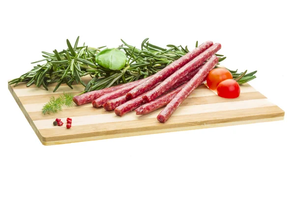 Salami mit Rosmarin, Basilikum und Tomaten — Stockfoto