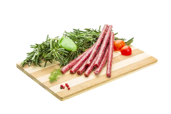 Salami with rosemary, basil and tomato — Stock Photo, Image