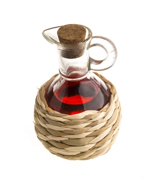 Small decanter with red wine vinegar isolated on the white — Stock Photo, Image