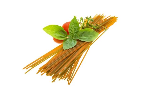 Color spaghetti with basil, thyme and tomato — Stock Photo, Image