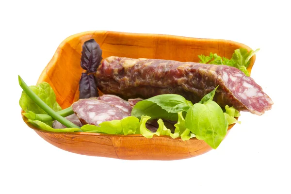 Ripe salami with salad, basil, onion and tomato — Stock Photo, Image