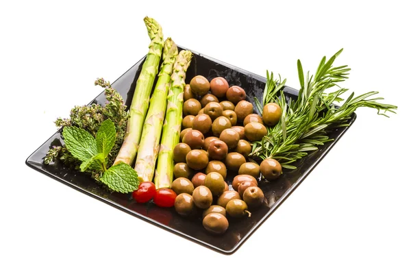 Olives, asparagus, rosemary, mint, thyme and tomato — Stock Photo, Image