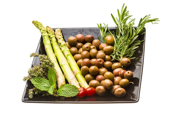 Olives, asparagus, rosemary, mint, thyme and tomato — Stock Photo, Image