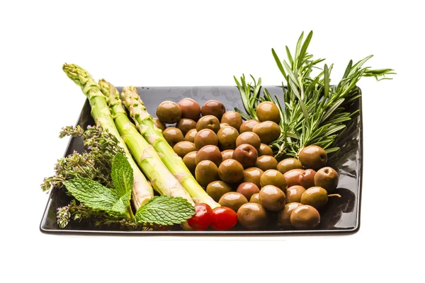 Olives, asparagus, rosemary, mint, thyme and tomato — Stock Photo, Image