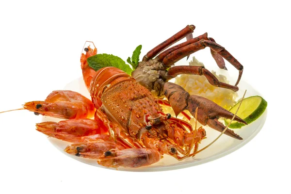 Spiny lobster, shrimps, crab legs and rice — Stock Photo, Image