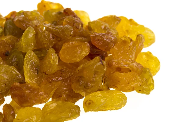 Golden raisins over white — Stock Photo, Image