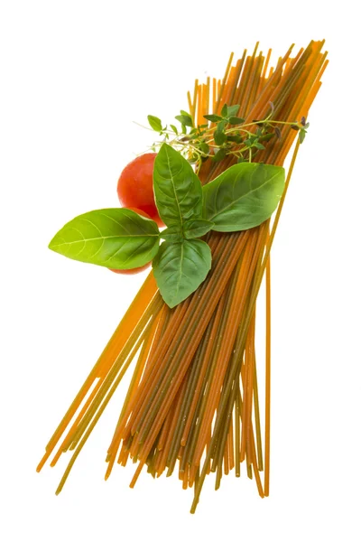 Color spaghetti with basil, thyme and tomato — Stock Photo, Image