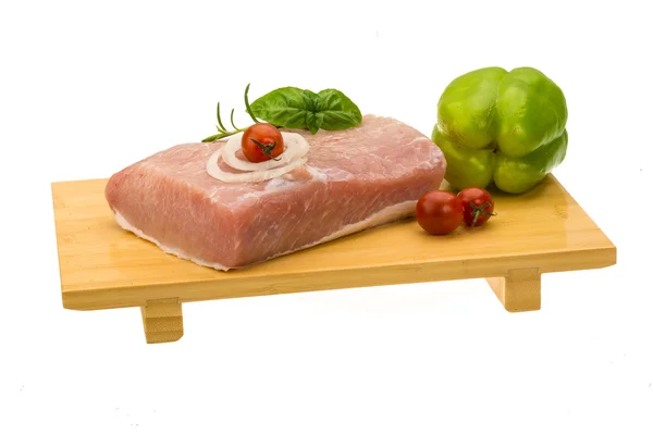 Raw pork with onion, basil and rosemary — Stock Photo, Image