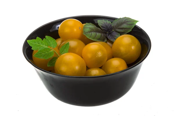 Yellow tomatoes with branch and basil — Stock Photo, Image