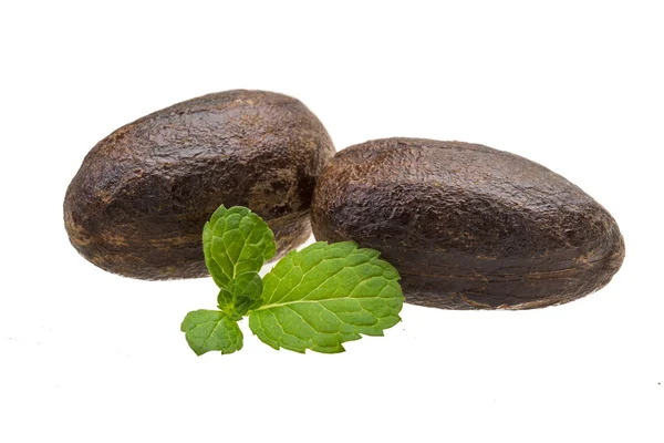 Nutmeg with mint leaf isolated — Stock Photo, Image