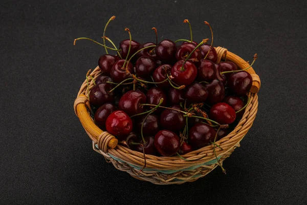 Sweet ripe bird cherry in the basket