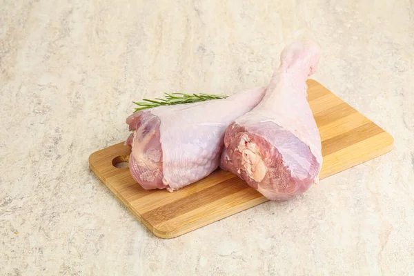 Raw turkey leg for cooking served rosemary