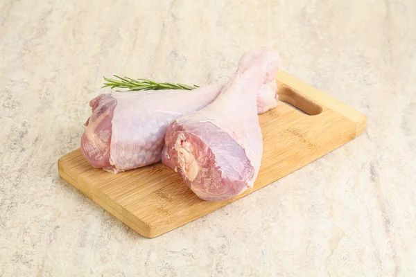 Raw turkey leg for cooking served rosemary