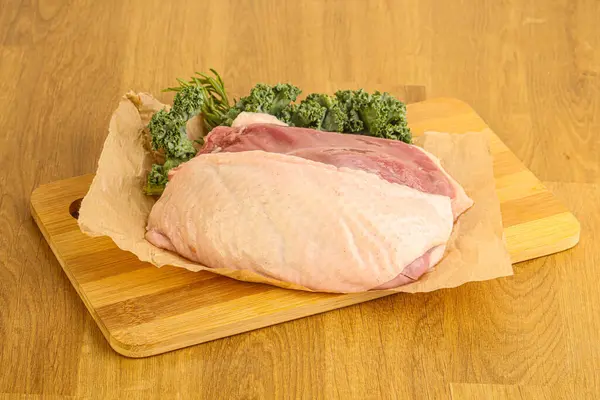 Raw duck breast for cooking over board