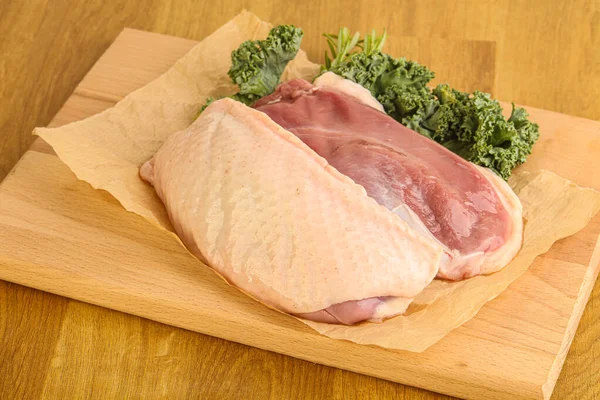 Raw duck breast for cooking over board