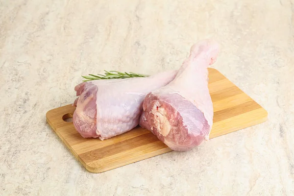 Raw turkey leg for cooking served rosemary