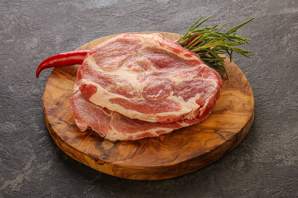 Raw pork meat neck steak for grill