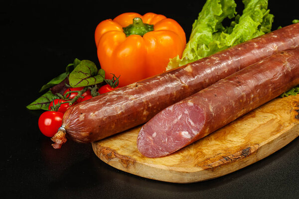 Delicous Pork ham sausage cut isolated