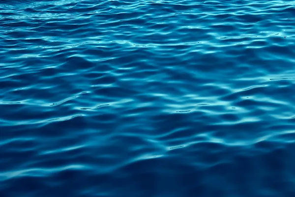 Blå toner vatten vågor bakgrund Royaltyfria Stockfoton