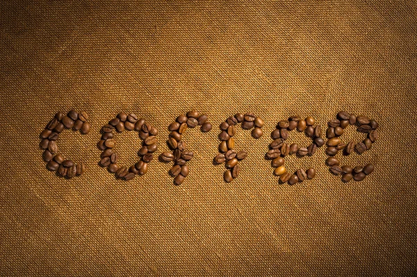 Palavra café feito de grãos de café — Fotografia de Stock