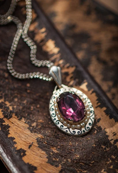 Vintage ruby pendant with chains — Stock Photo, Image