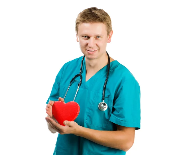 Manliga läkare med ett hjärta i hans händer — Stockfoto
