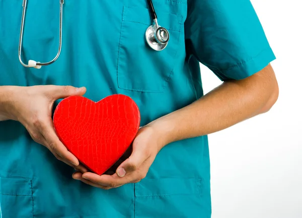 Doctor holding a heart symbol — Stock Photo, Image