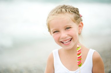 Little girl on the beach clipart