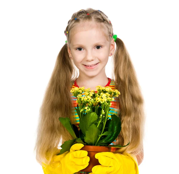 Menina segurando uma planta — Fotografia de Stock