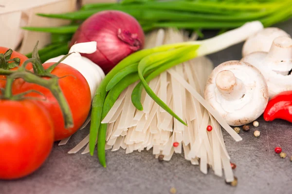 Fresh raw vegetables and rice noodles — Stock Photo, Image