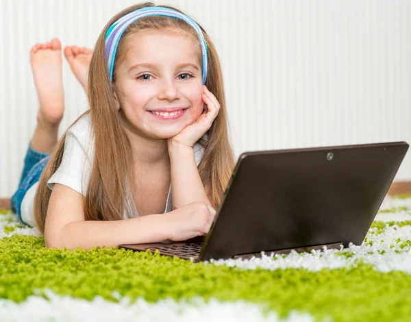 Little girl with a laptop Royalty Free Stock Images