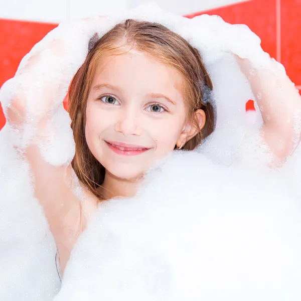 Small pretty girl is taking a bath — Stock Photo, Image