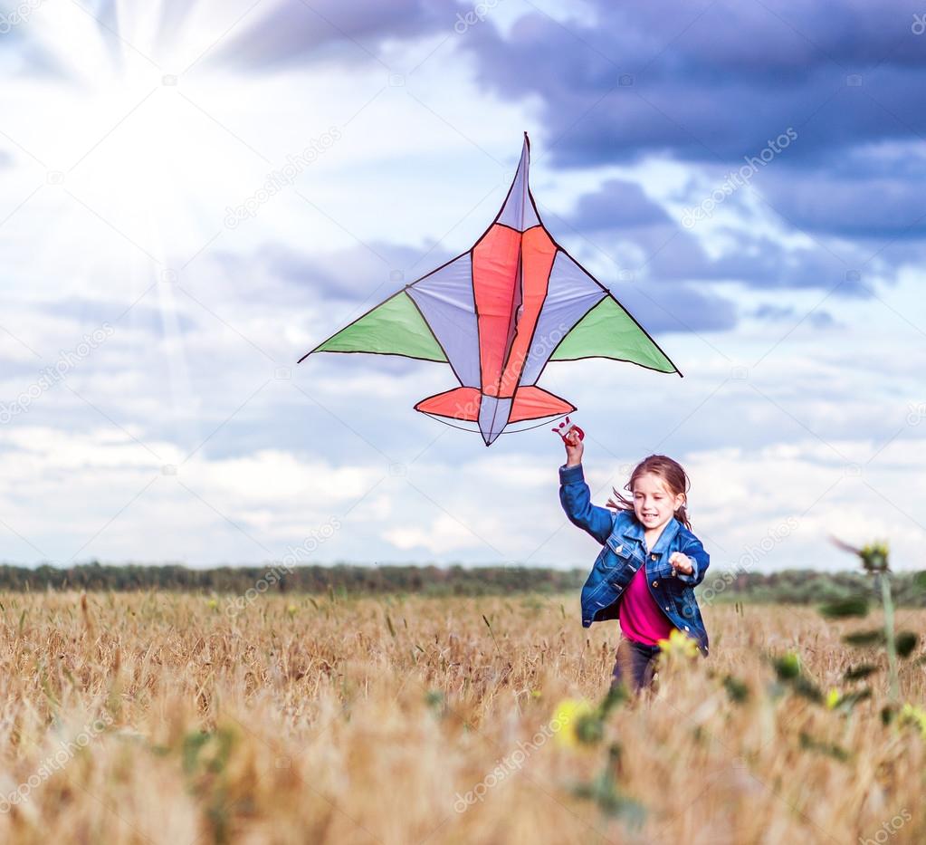 little girl flies a kite