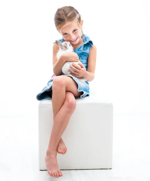 Cute little girl a white rabbit — Stock Photo, Image