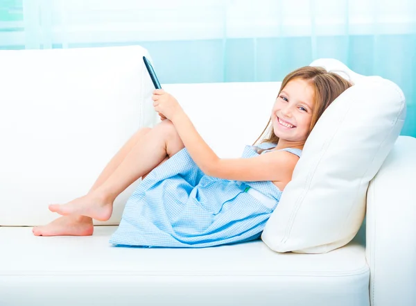 Little girl holding a e-book — Stock Photo, Image