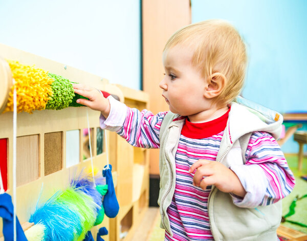 little girl in the classroom early development