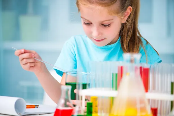 Little girl with flasks — Stock Photo, Image