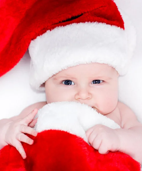 Newborn baby in a Santa hat Stock Image