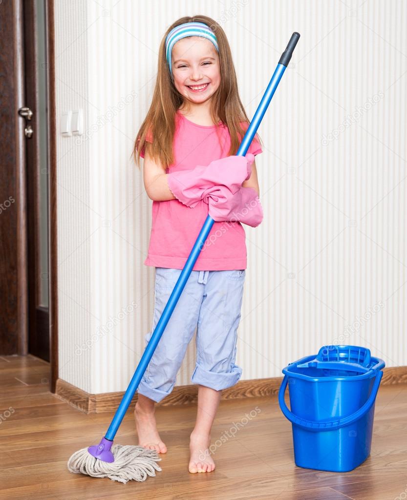 little girl washing the floor