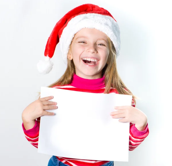 Dziewczynka w kapeluszu Świętego Mikołaja — Zdjęcie stockowe