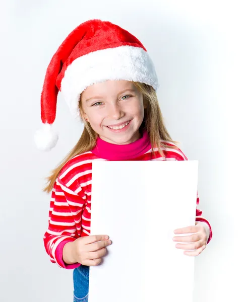 Dziewczynka w kapeluszu Świętego Mikołaja — Zdjęcie stockowe
