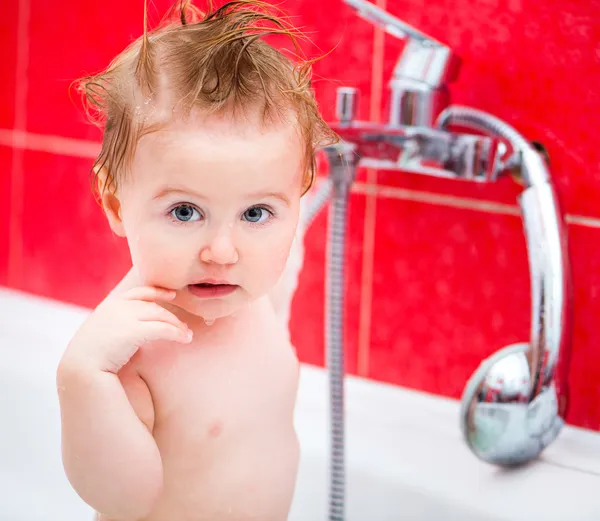 Cute 1 year-old girl bathes — Stock Photo, Image