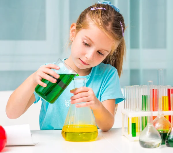 Little girl with flasks — Stock Photo, Image