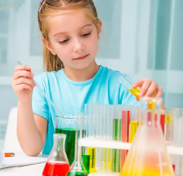 Little girl with flasks — Stock Photo, Image