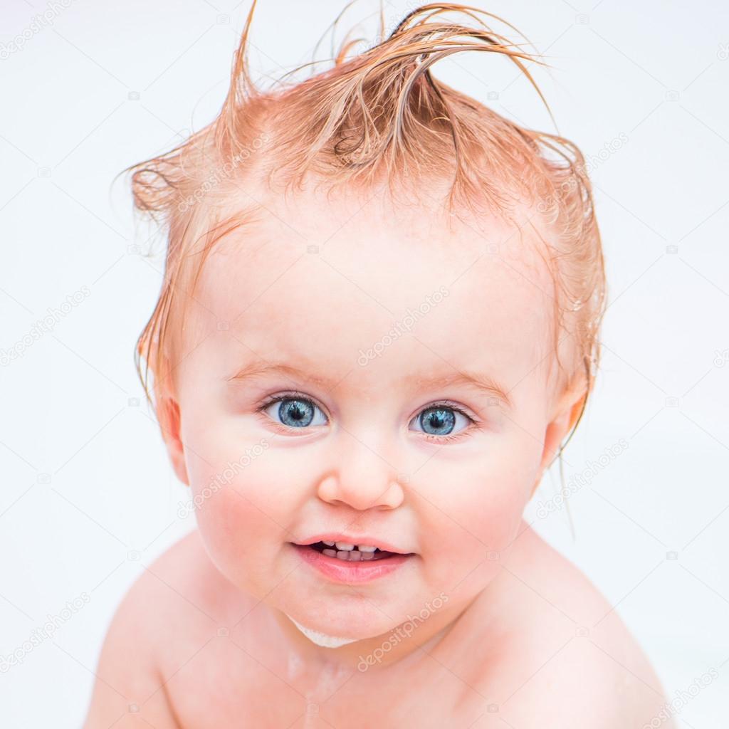 cute 1 year-old girl bathes